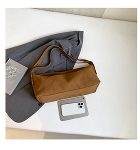 Detail of vintage matte brown crossbody bag with silver rivets and size reference
