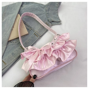 Pink satin shoulder bag featuring ruffles, bow detail and matching slim strap