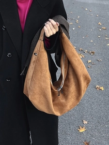 Brown suede tote bag for women showing a large capacity minimalist hobo shoulder style