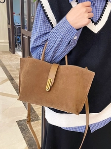 Vintage brown frosted leather tote bag with gold oval buckle and shoulder strap