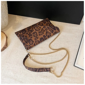 Leopard print envelope bag detail with gold chain strap and animal pattern texture