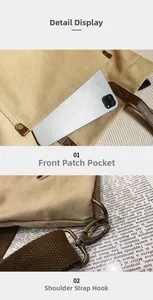 Detail view of khaki canvas tote bag featuring a front pocket and metal strap hooks