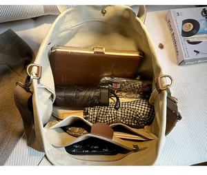 Internal view of canvas tote bag showing spacious compartments and functional pockets