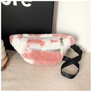 Detail of pink and white cow print teddy fleece fanny pack with dual metal zippers