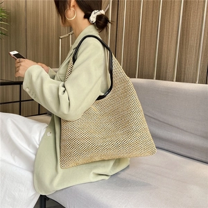 Large capacity woven tote bag with black leather straps for summer beach vacations