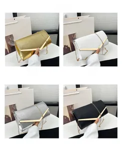Collage of four clutch bags in gold, white, silver, and black with V-shaped metal trim