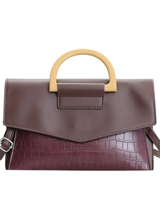 Elegant two-tone faux leather handbag with crocodile pattern and wooden handle