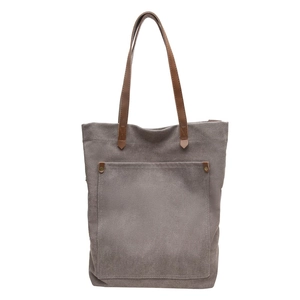 Minimalist vintage grey canvas tote bag with brown leather handles and gold rivet details