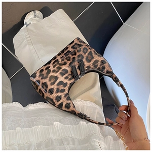 Detail of leopard print hobo bag showing semi-circle shape and double zipper closure