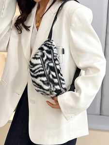 Fuzzy faux fur zebra print fanny pack with dual silver zippers and adjustable strap