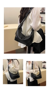 Close-up of black crescent dumpling bag showing adjustable strap and premium soft texture