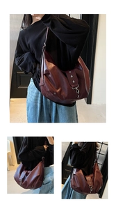 Detail view of burgundy leather hobo bag with silver star studs and metal buckle accents