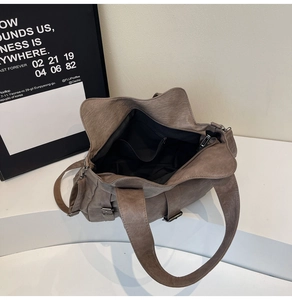 Spacious interior of tote bag showing black fabric lining and internal zipper pocket