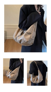Detailed close-up of khaki motorcycle-style tote bag featuring silver metal rivets and soft PU leather