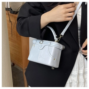 Mini denim-style light blue handbag with vintage stitching and metal buckle detail