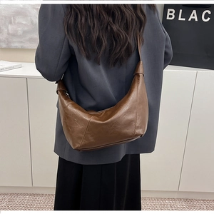 Deep brown retro faux oil-wax leather dumpling bag with decorative stitching details