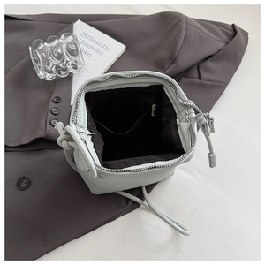 Top view of mint green shell bag showing spacious interior with zipper pocket