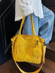 Large capacity yellow nylon tote bag with adjustable strap and small round coin purse
