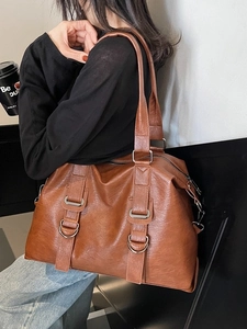 Large caramel brown leather tote bag with silver hardware for women's daily commute