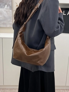 Brown faux leather crescent hobo bag for women with adjustable strap in vintage style
