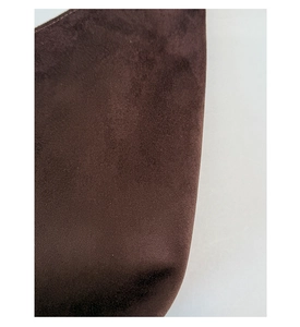 Close-up of the premium dark brown suede leather texture and fine fiber finish on the tote bag