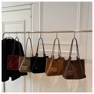 Detailed close-up of matte tote bags with matching coin purses in five retro colors