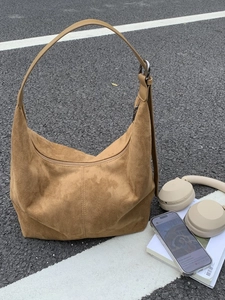 Brown suede hobo shoulder bag with adjustable strap for casual daily commuting