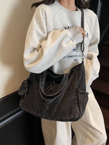 Fashionable charcoal denim tote bag with adjustable strap and small round coin purse