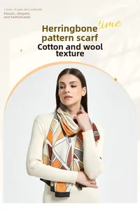 Detail view of herringbone pattern silk scarf with cotton-wool feel on a female model
