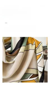 Close-up of herringbone pattern silk scarf with premium stitching and silky texture