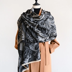 Close-up detail of Chinese style cashmere-like scarf with black and gold mountain clouds