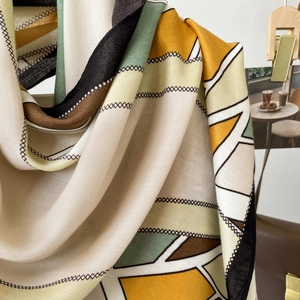 Detail of herringbone pattern long silk scarf with geometric color block splicing design