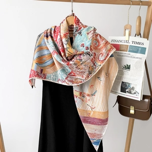 Detail of luxury silk scarf with colorful hot air balloon print on a wooden hanger