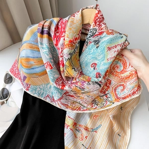 Detailed view of luxury silk scarf with French illustration and hand-rolled edges