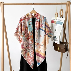 Luxurious silk scarf with colorful illustration pattern draped over a black dress