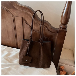 Detail of vintage matte tote bag showing suede texture and mini snap coin purse
