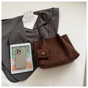 Detailed top view of large dark brown matte suede tote bag with small matching purse