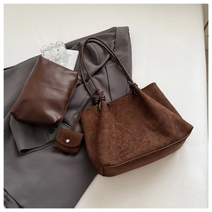 Detail view of retro brown frosted tote bag with inner pouch and knot handle design