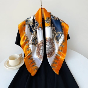 Detail of 90cm square satin scarf with baroque pattern draped over a black dress