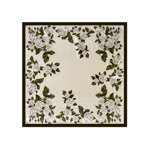 Flat lay detail of a satin square scarf with white camellia flowers and dark brown borders