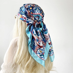 Detailed back view of a 90cm vintage floral satin square scarf worn as a headscarf