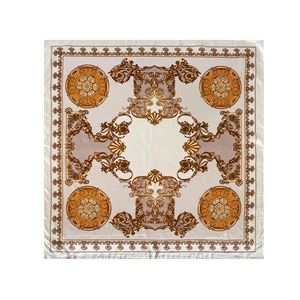 Close-up of Baroque paisley print silk scarf featuring golden medallions on beige satin