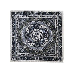 Detailed close-up of retro floral prints on a navy blue silk satin square headscarf