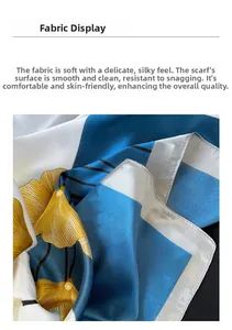 Detailed fabric texture of satin silk scarf with yellow ginkgo leaves and fine machine hem