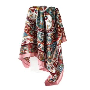 Retro vintage floral printed silk scarf with colorful patterns on a white stand