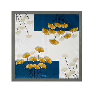Detailed close-up of 90cm square satin scarf featuring golden ginkgo leaf print design