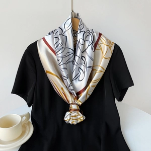 Elegant 90cm floral satin scarf with gold patterns and burgundy borders on a black tee
