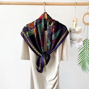 Detail of elegant 90cm purple satin scarf with vintage orange floral print on white dress