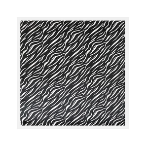 Detailed view of square satin scarf with bold black and white zebra print pattern