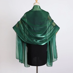 Detailed back view of deep green organza shawl showing smooth texture and elegant drape